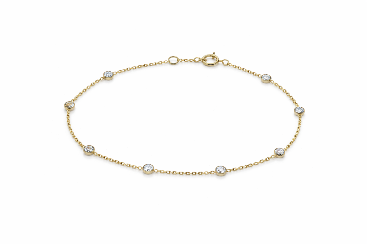 Lab diamond bracelet in solid 18K gold with bezel set stations on a fine chain