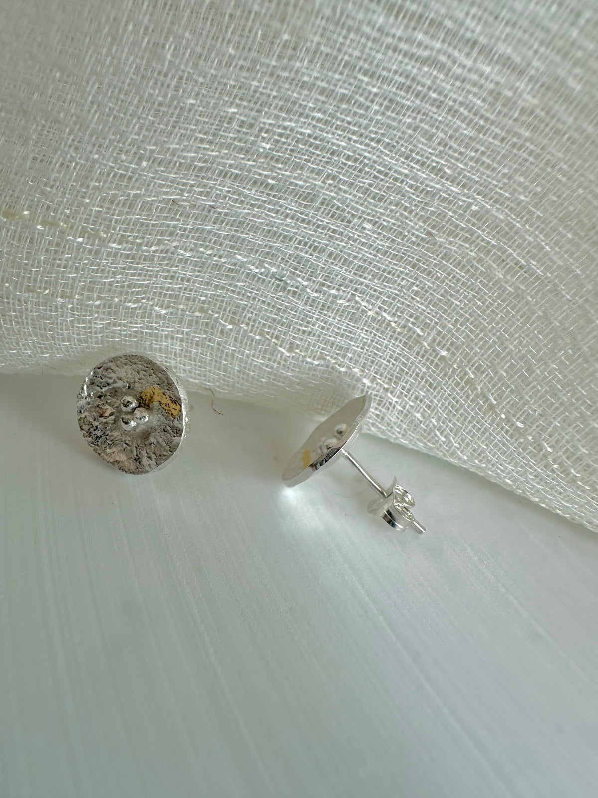 Round silver disc studs with gold foil in recycled sterling silver
