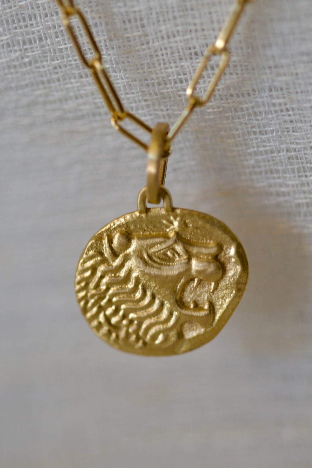 18K lion coin pendant inspired by the ancient Lydian lion stater, brushed finish | Yasmin Nabulsi Fine Jewelry