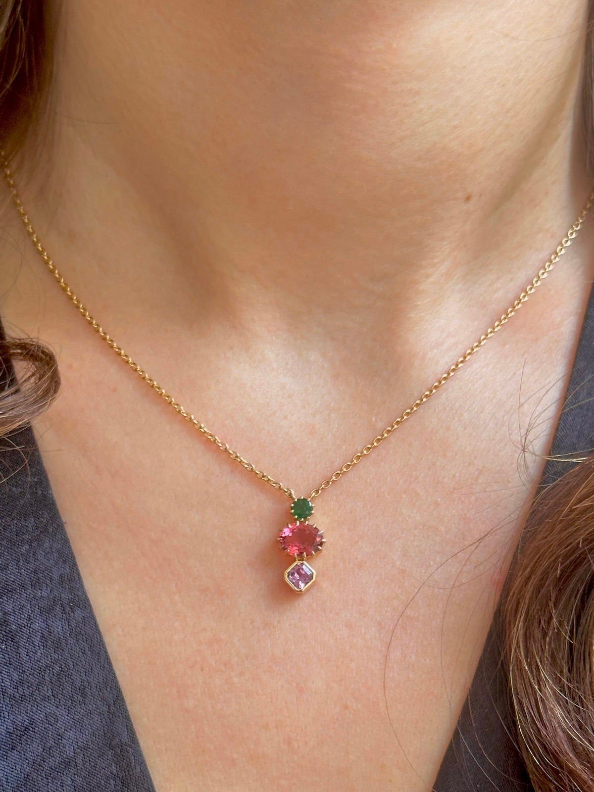 18K gold cluster necklace with emerald, tourmaline and sapphire stones