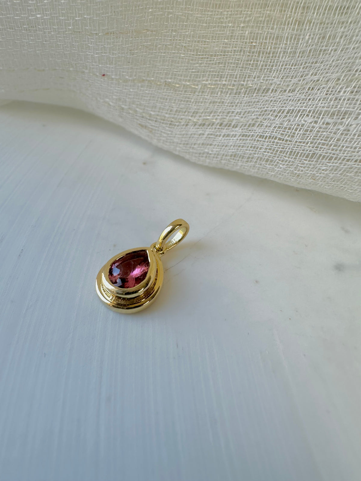 Pear pink tourmaline pendant in 14K or 18K gold, shown from another angle