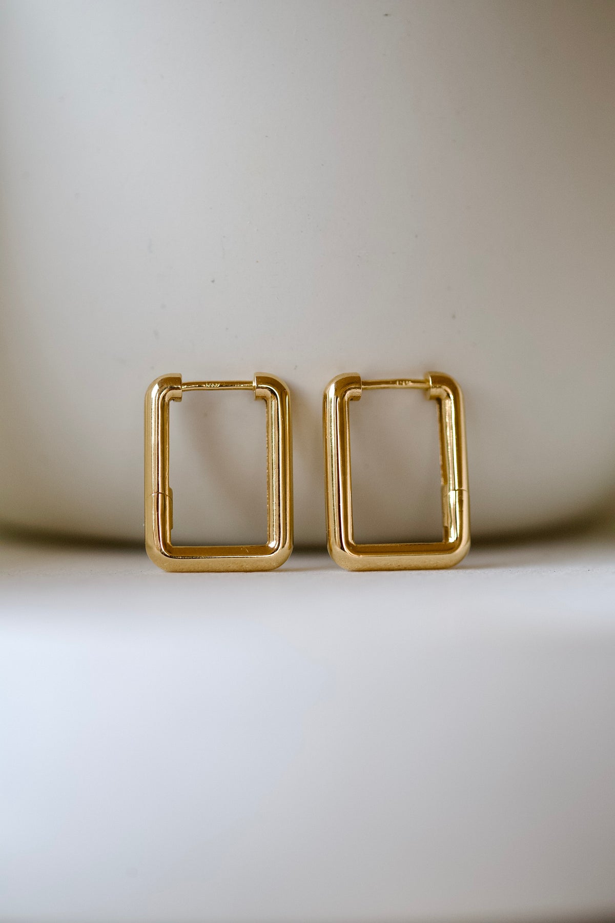 Pair of polished 18K yellow gold rectangular hoops, handcrafted in Lebanon