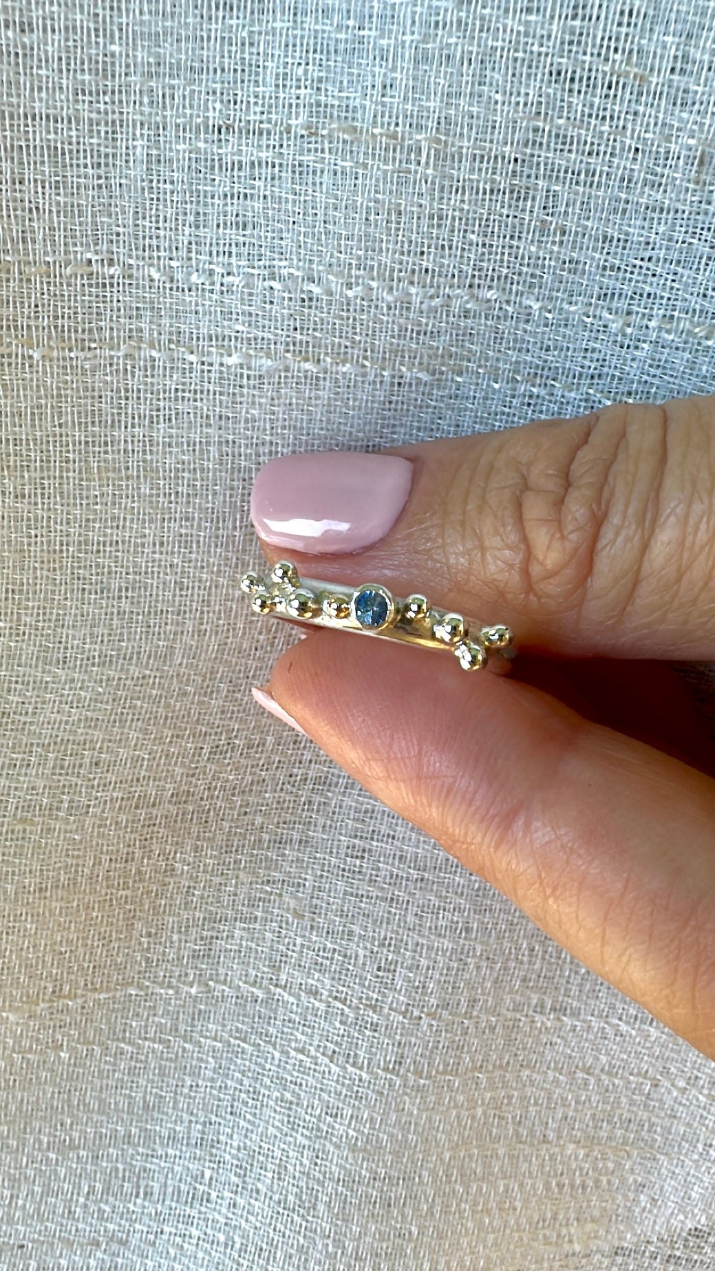 Organic silver ring with a blue sapphire center stone and granulation | Yasmin Nabulsi Fine Jewelry