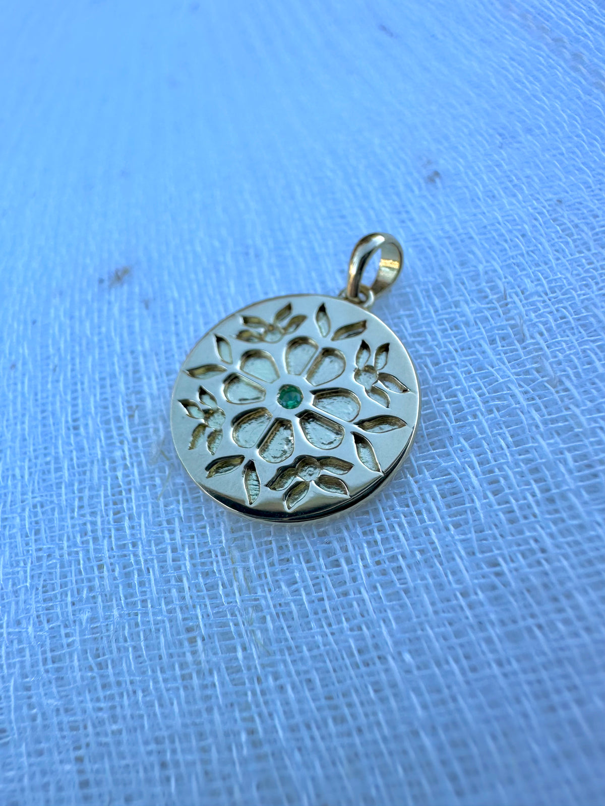 Gold coin pendant with a floral design in 10mm or 14mm diameter