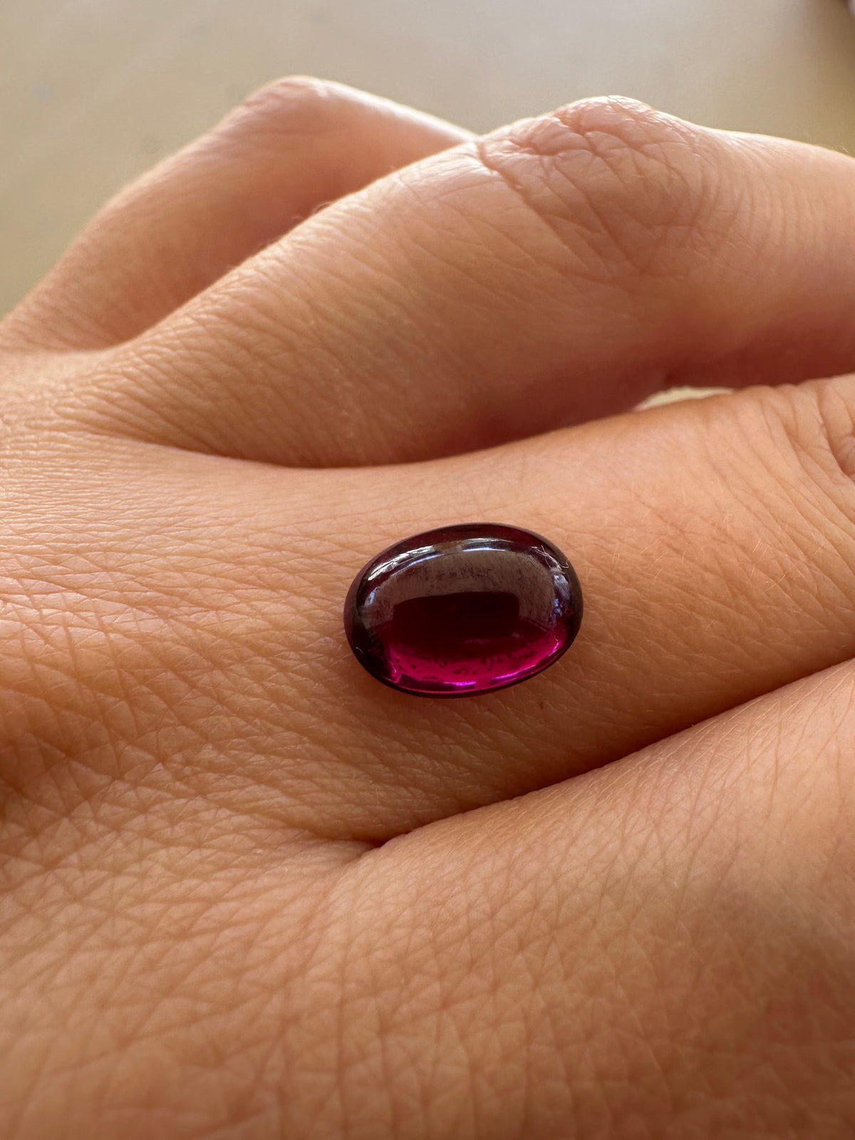 Oval cabochon purple garnet, 10 x 7.4mm