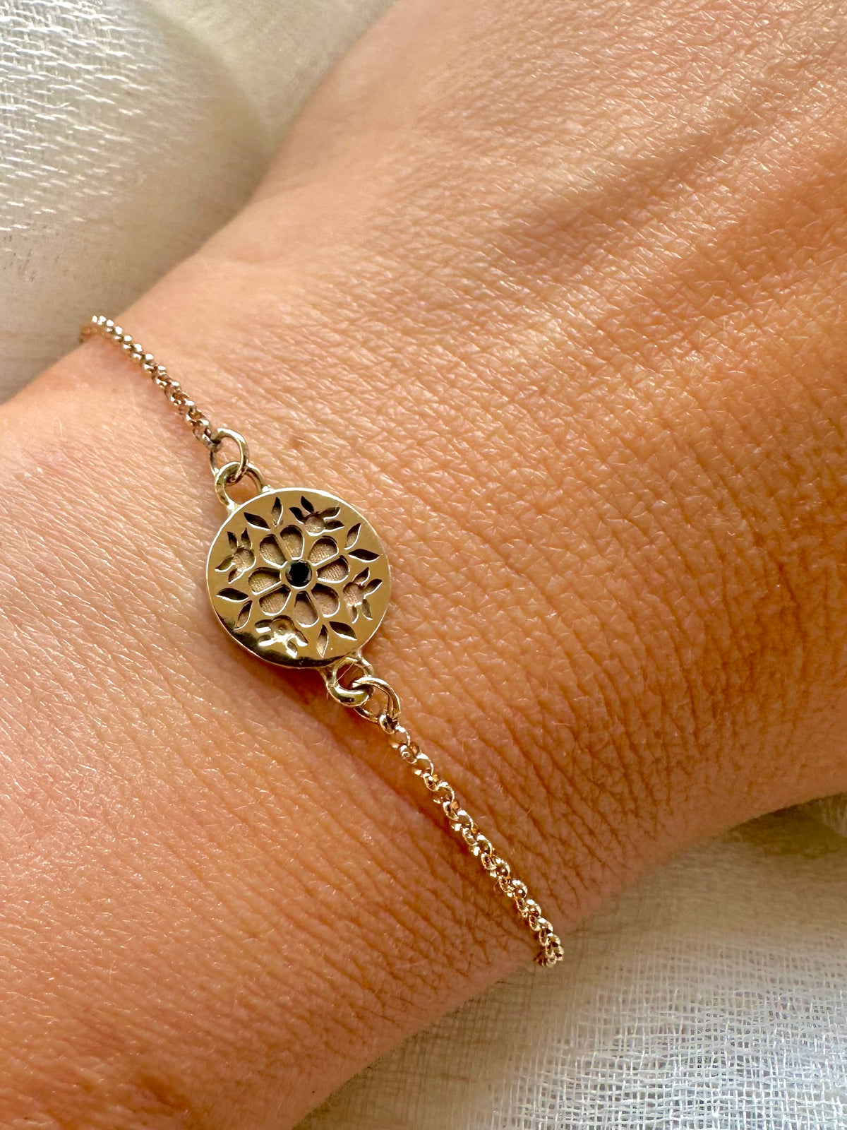 Tatreez rolo chain bracelet with a floral engraved charm in silver or 14K gold | Yasmin Nabulsi Fine Jewelry