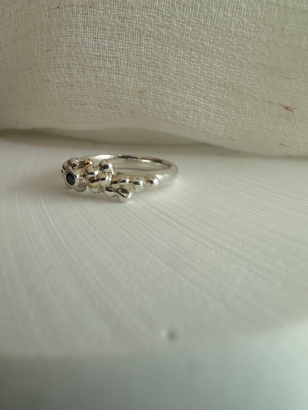 Silver ring made from D shape wire with a sapphire bezel, US size 6