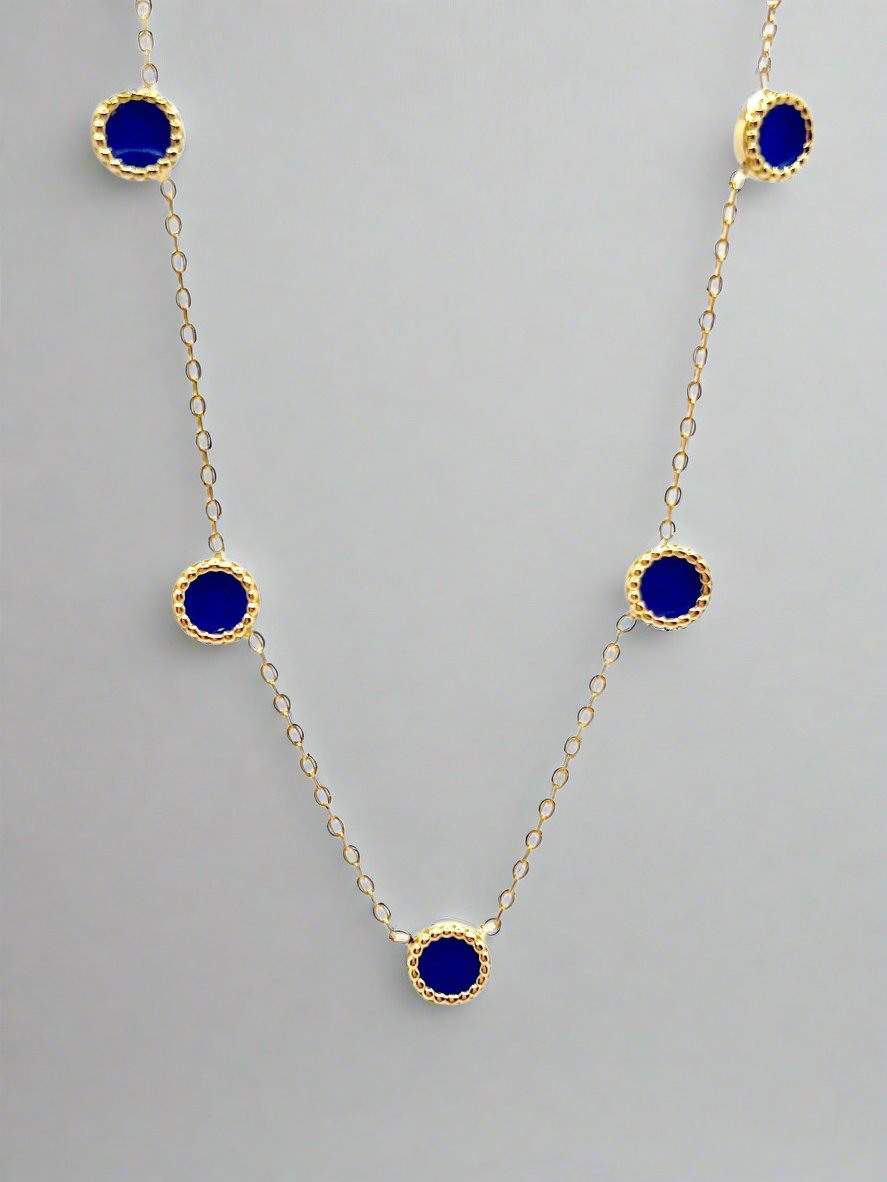 Gold anklet with five round enamel charms and a spring ring clasp