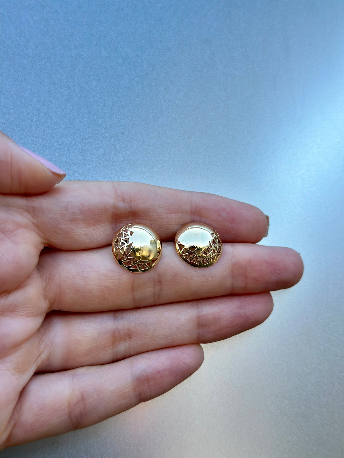 18K gold button earrings with triangular cutouts visible from the front and back