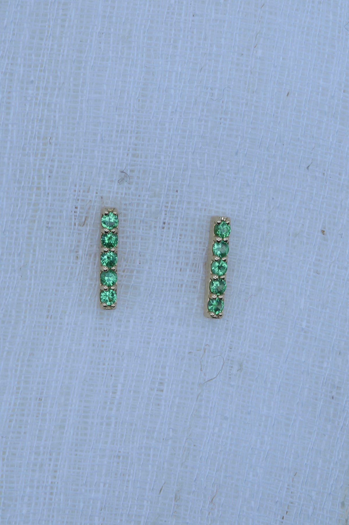 18K yellow gold bar stud earrings with ten round tsavorite gemstones | Yasmin Nabulsi Fine Jewelry