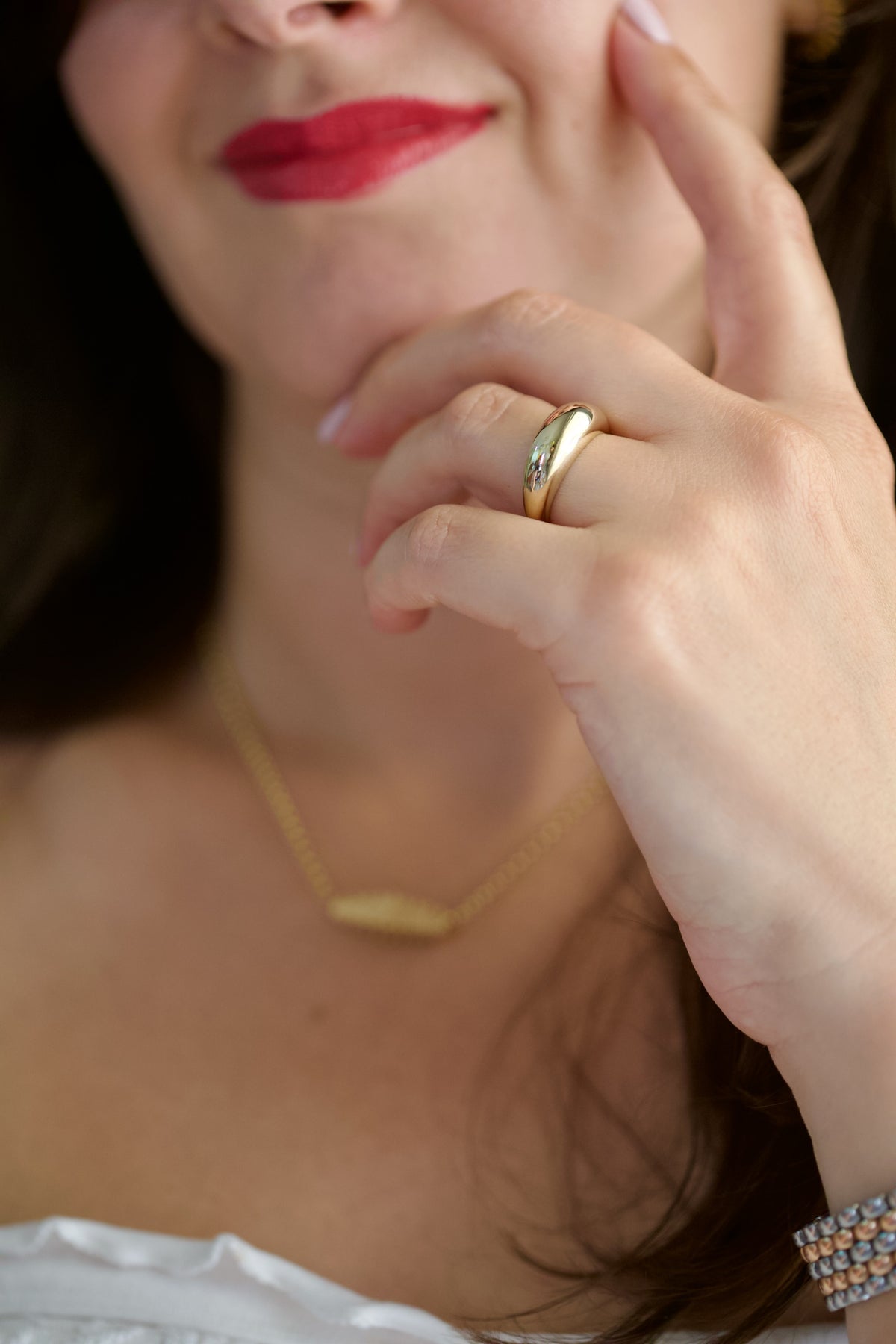 Gold dome ring side view, 7.5mm crown tapering to 2.5mm