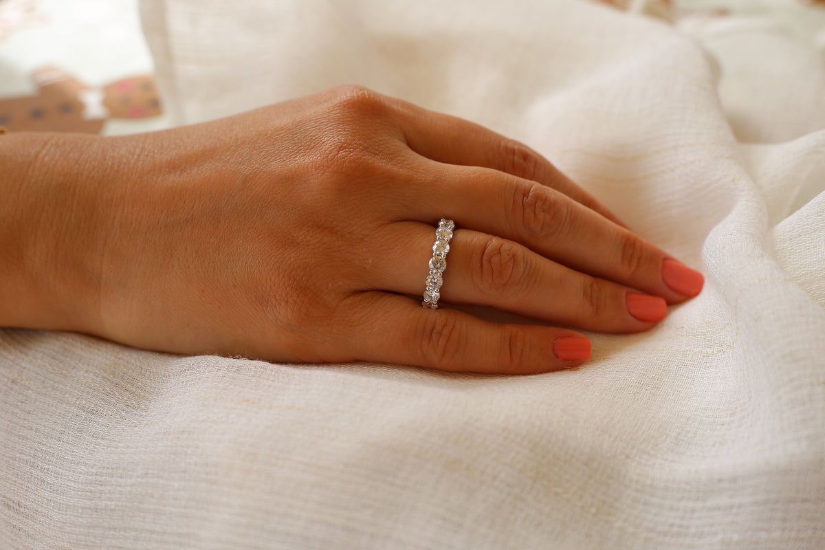 Half-eternity band for stacking with an engagement ring or worn alone