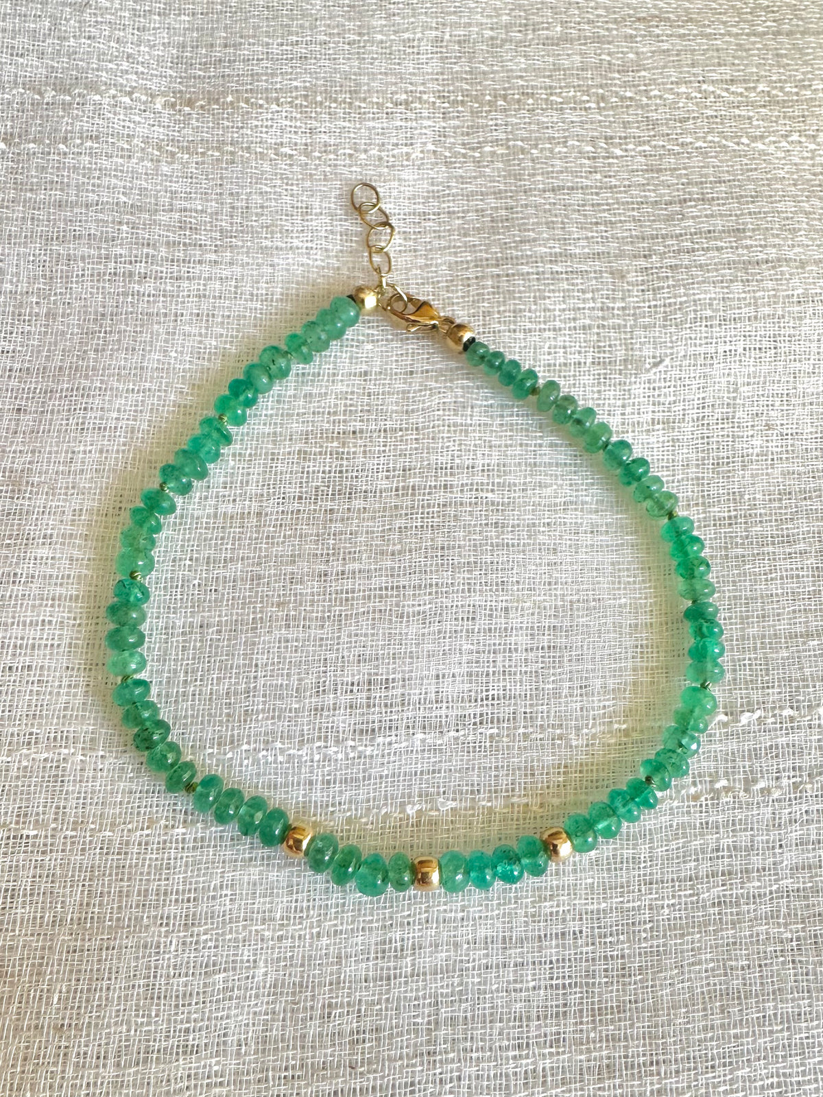 Oval emerald beaded bracelet, hand-knotted with 18K gold beads and a 14K lobster clasp | Yasmin Nabulsi Fine Jewelry
