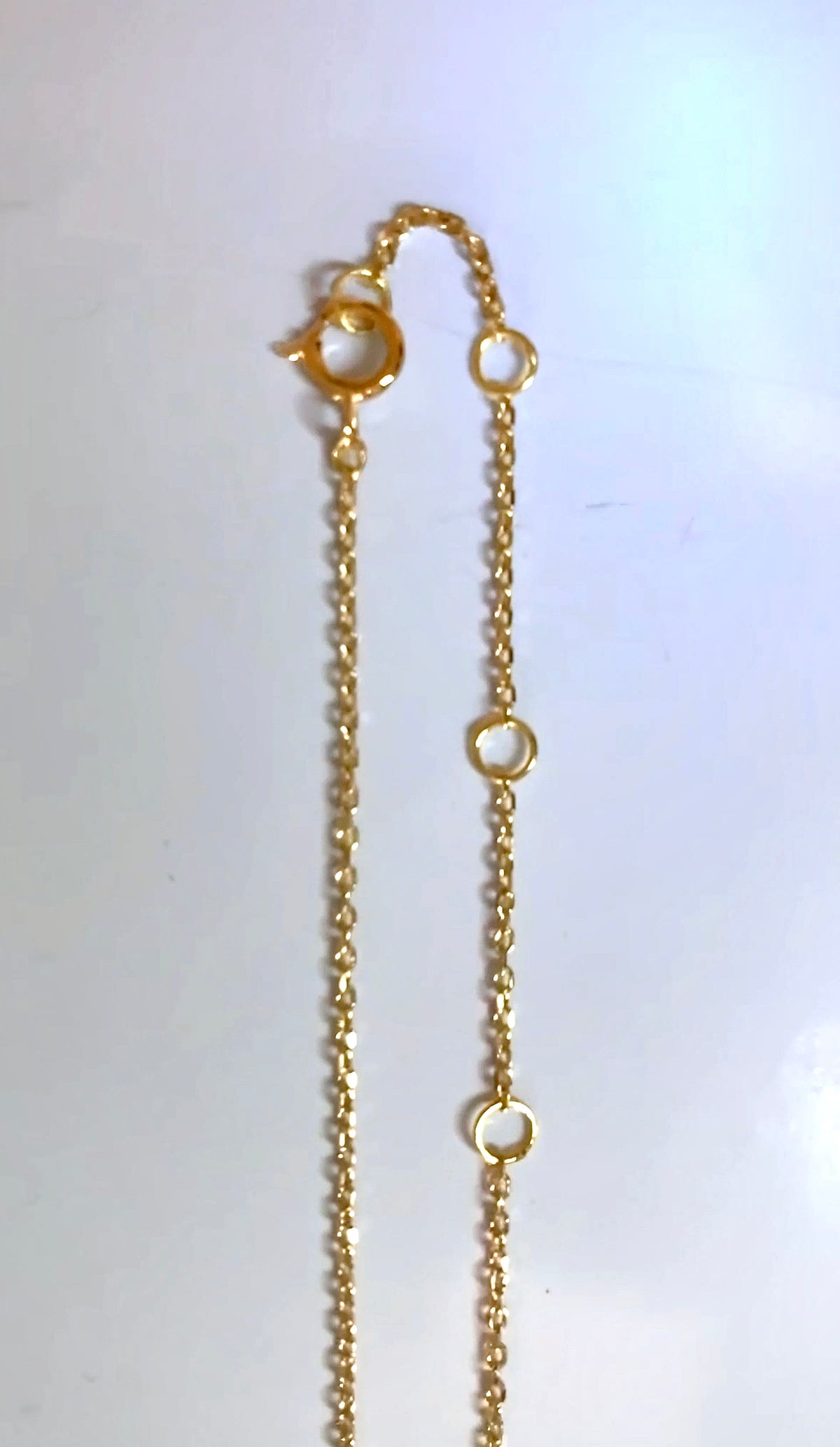 Dainty 18K gold diamond necklace, worn for layering or on its own