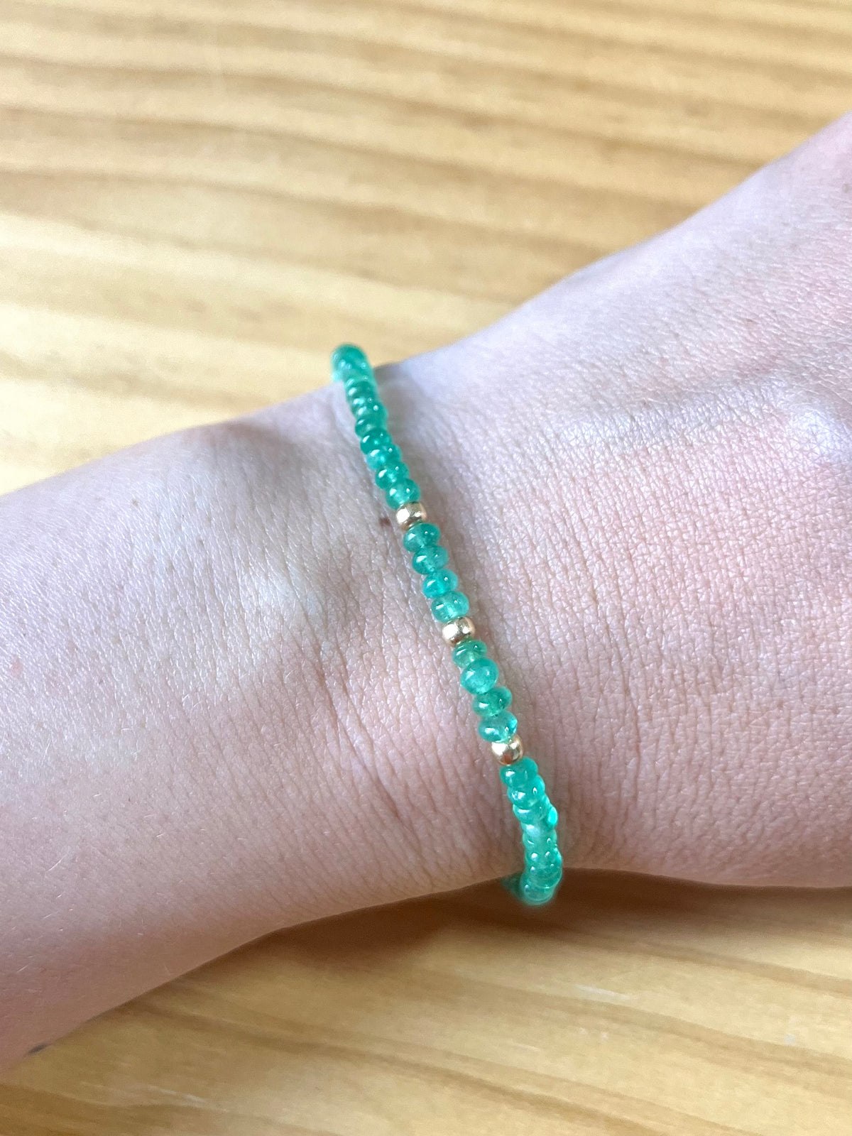 Emerald beaded bracelet with gold findings, hand-knotted in Las Vegas, Nevada