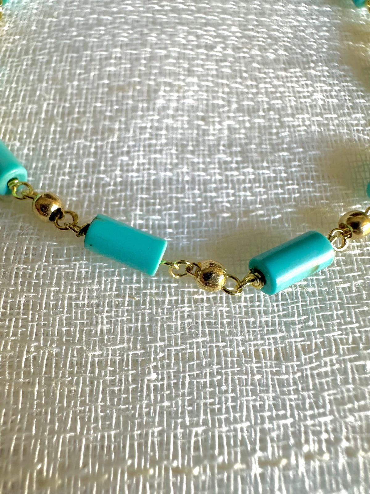 Gold and turquoise bracelet with extension loops for an adjustable fit