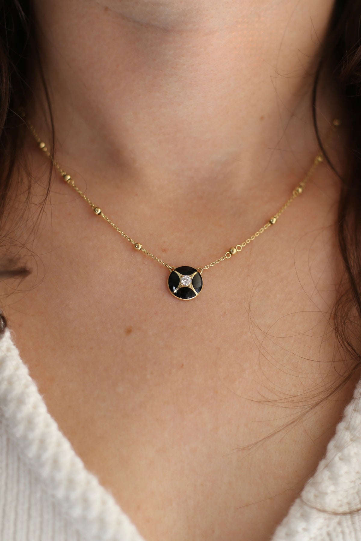18K gold necklace with a black enamel charm and a 0.10ct lab diamond | Yasmin Nabulsi Fine Jewelry