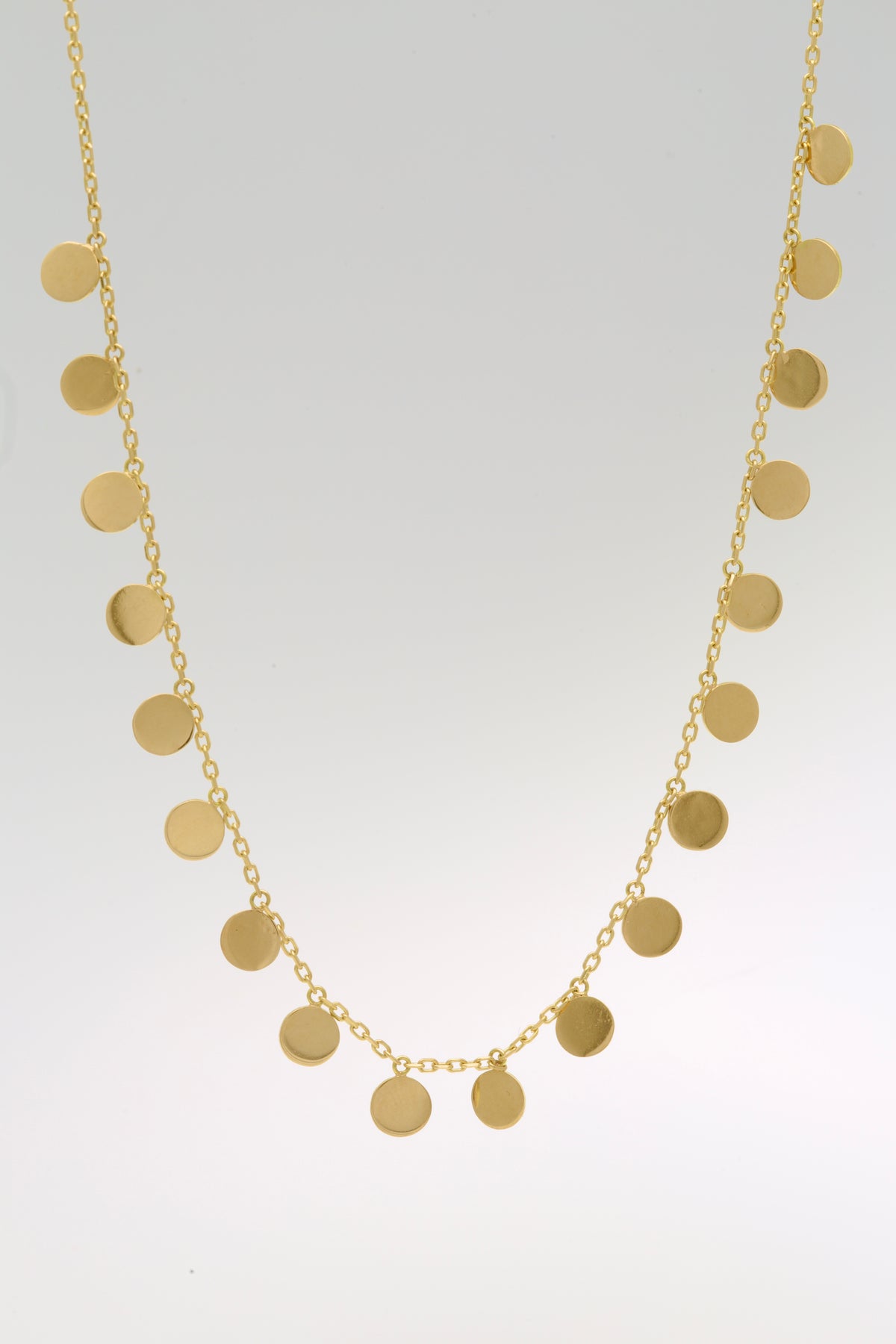 18K solid gold disc necklace with nineteen 5mm discs on a 1.2mm cable chain | Yasmin Nabulsi Fine Jewelry