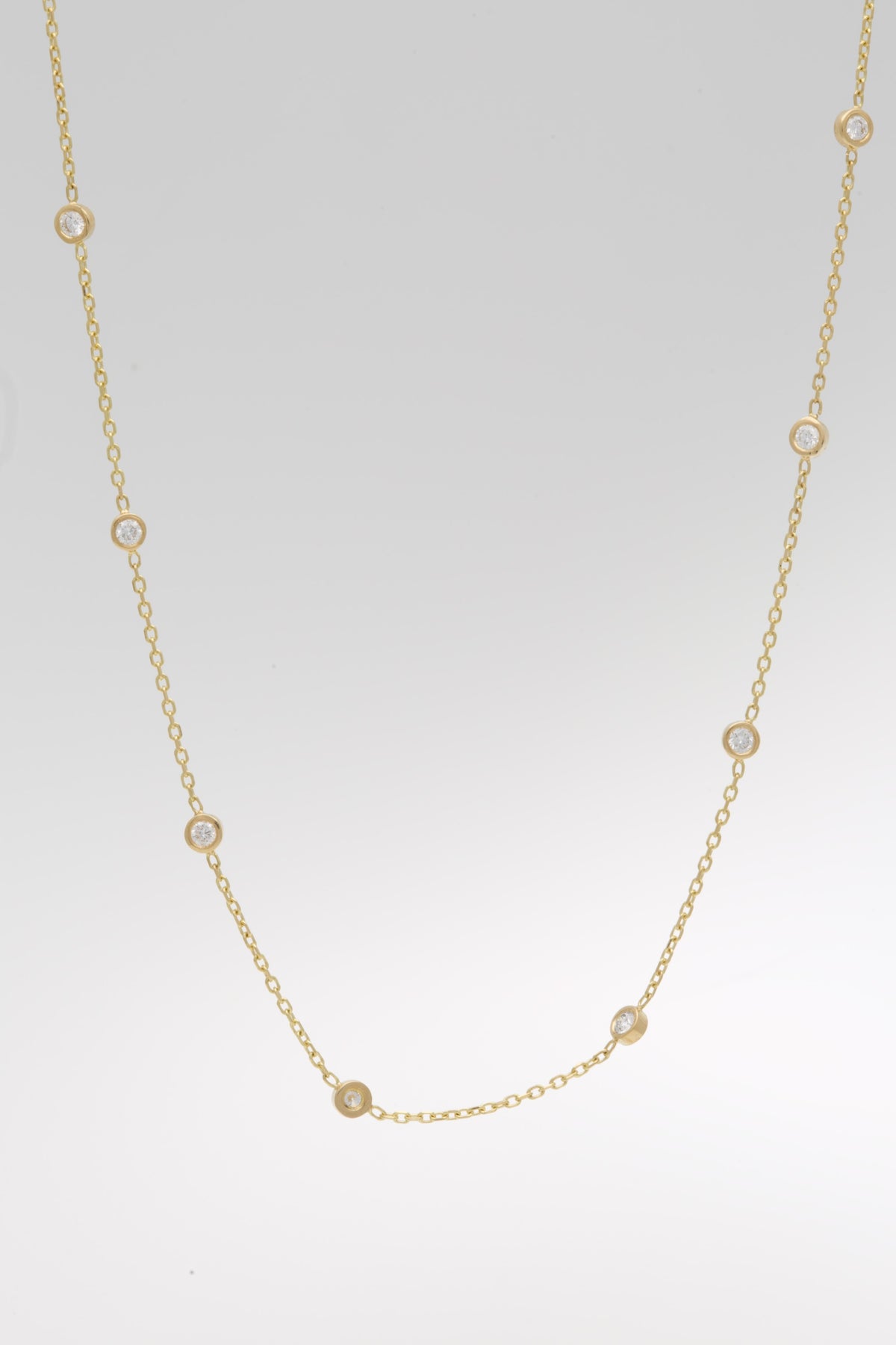 Lab diamond station necklace in solid 18K gold with ten bezel set diamonds | Yasmin Nabulsi Fine Jewelry