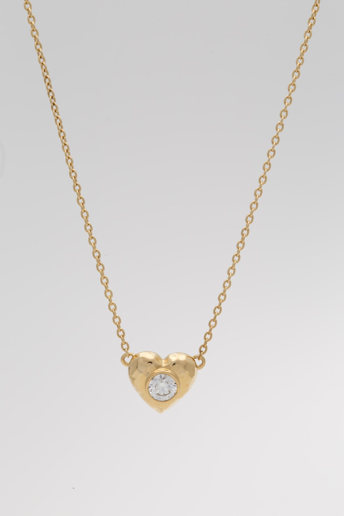 18K gold puffy heart pendant with a bezel set lab diamond | Yasmin Nabulsi Fine Jewelry