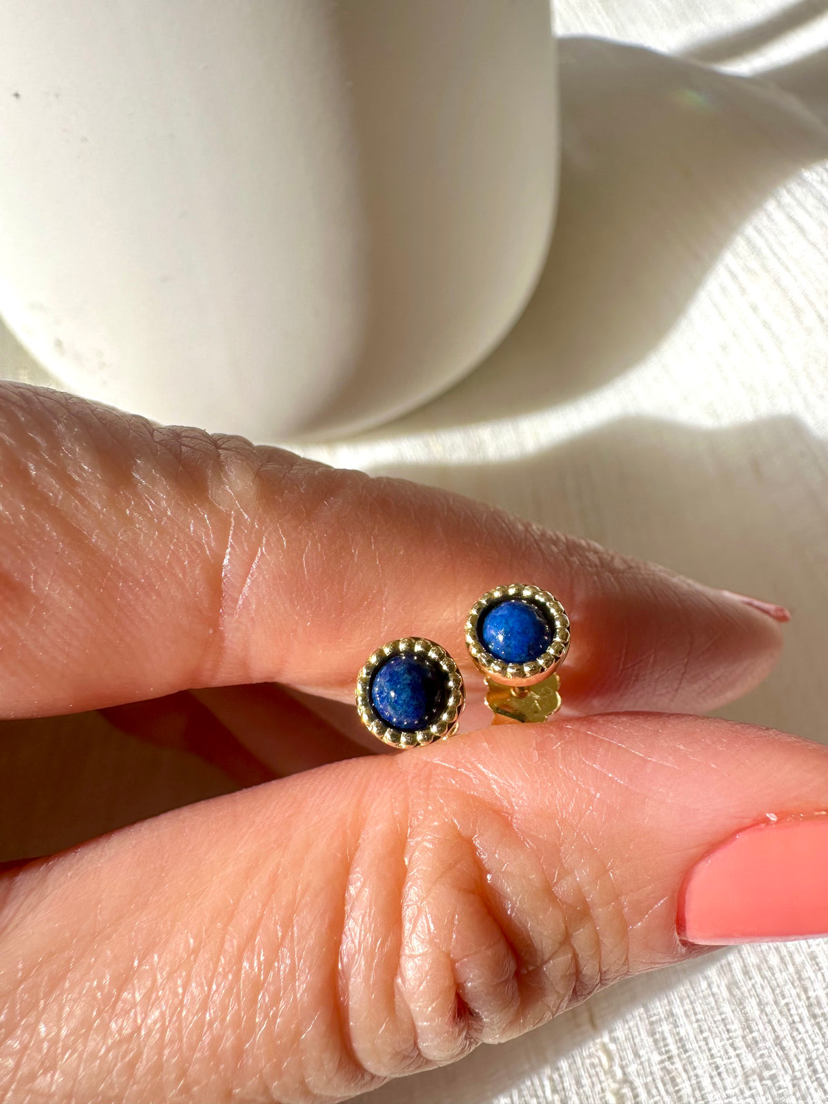 Round lapis lazuli cabochon stud earrings in a thick 18K gold bezel | Yasmin Nabulsi Fine Jewelry