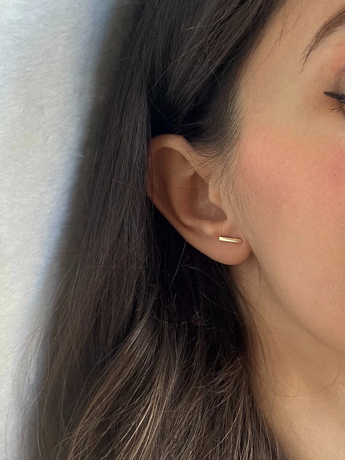 18 karat gold bar studs, 9.6 by 1.7mm, a linear design for everyday wear