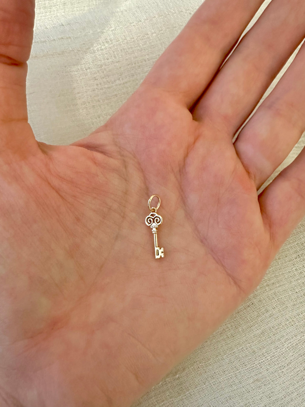 Key of Return gold charm, available in 14K and 18K gold