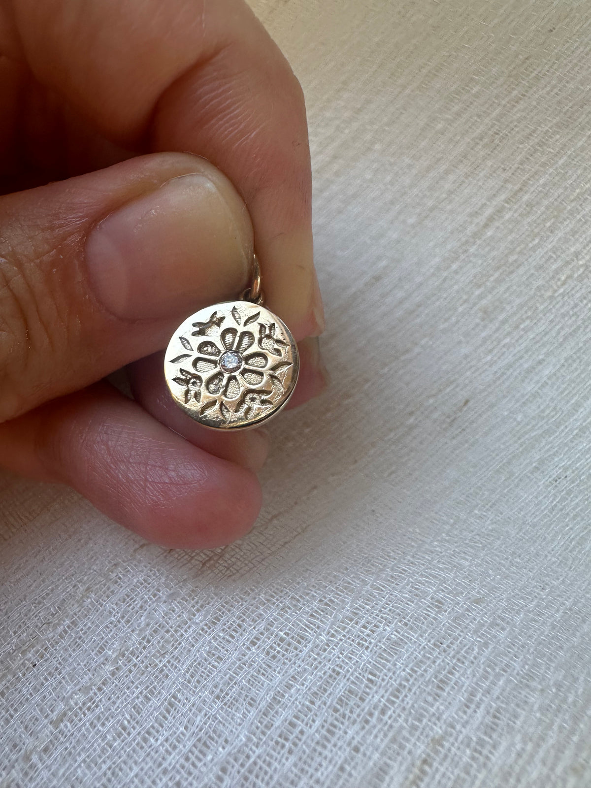 Tatreez-inspired gold pendant with a ruby, tsavorite or diamond center stone