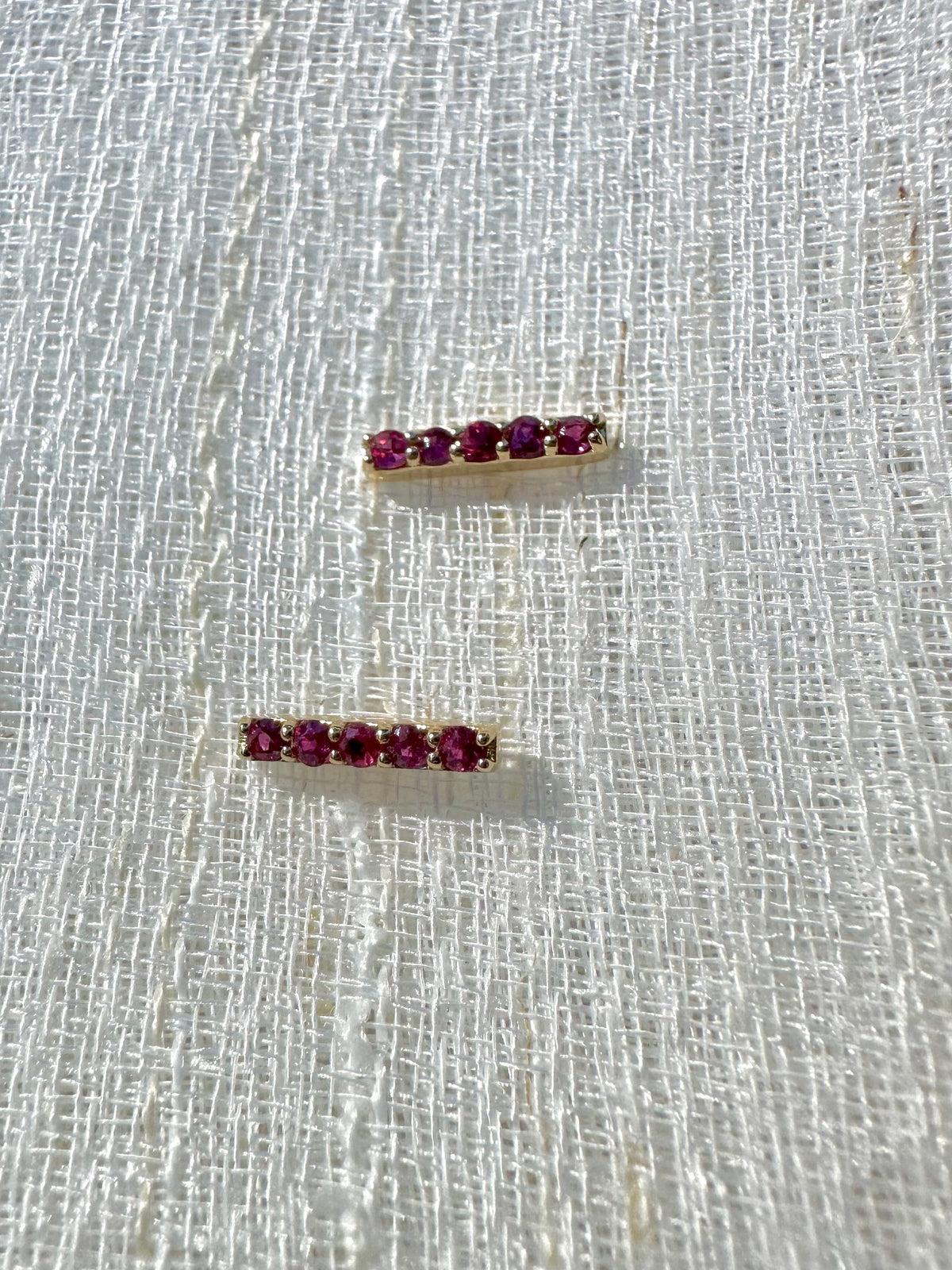 Pair of ruby bar studs with butterfly backs, 9.6 by 1.7mm
