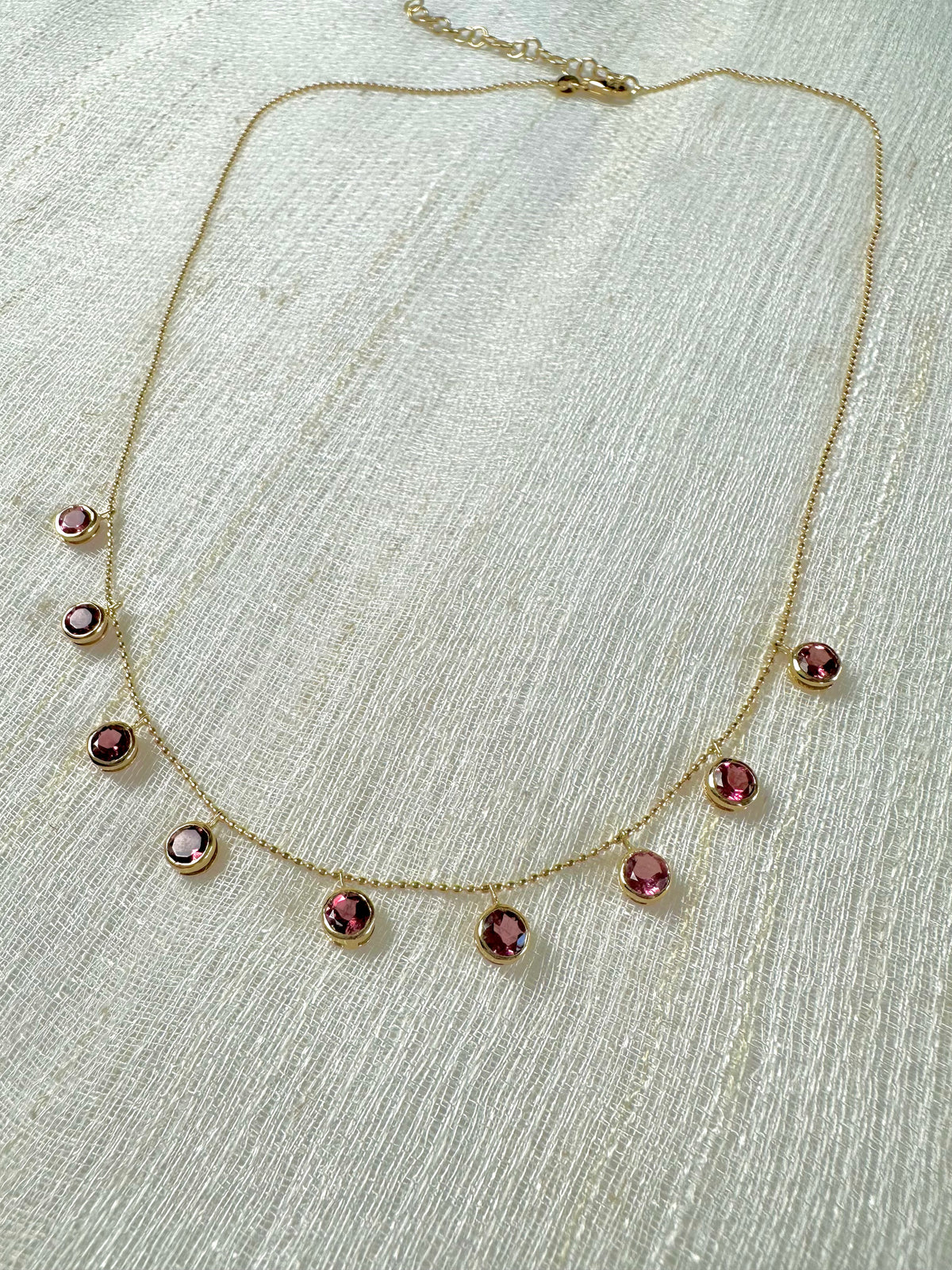 Pink tourmaline drop necklace in solid 18K gold, an October birthstone piece