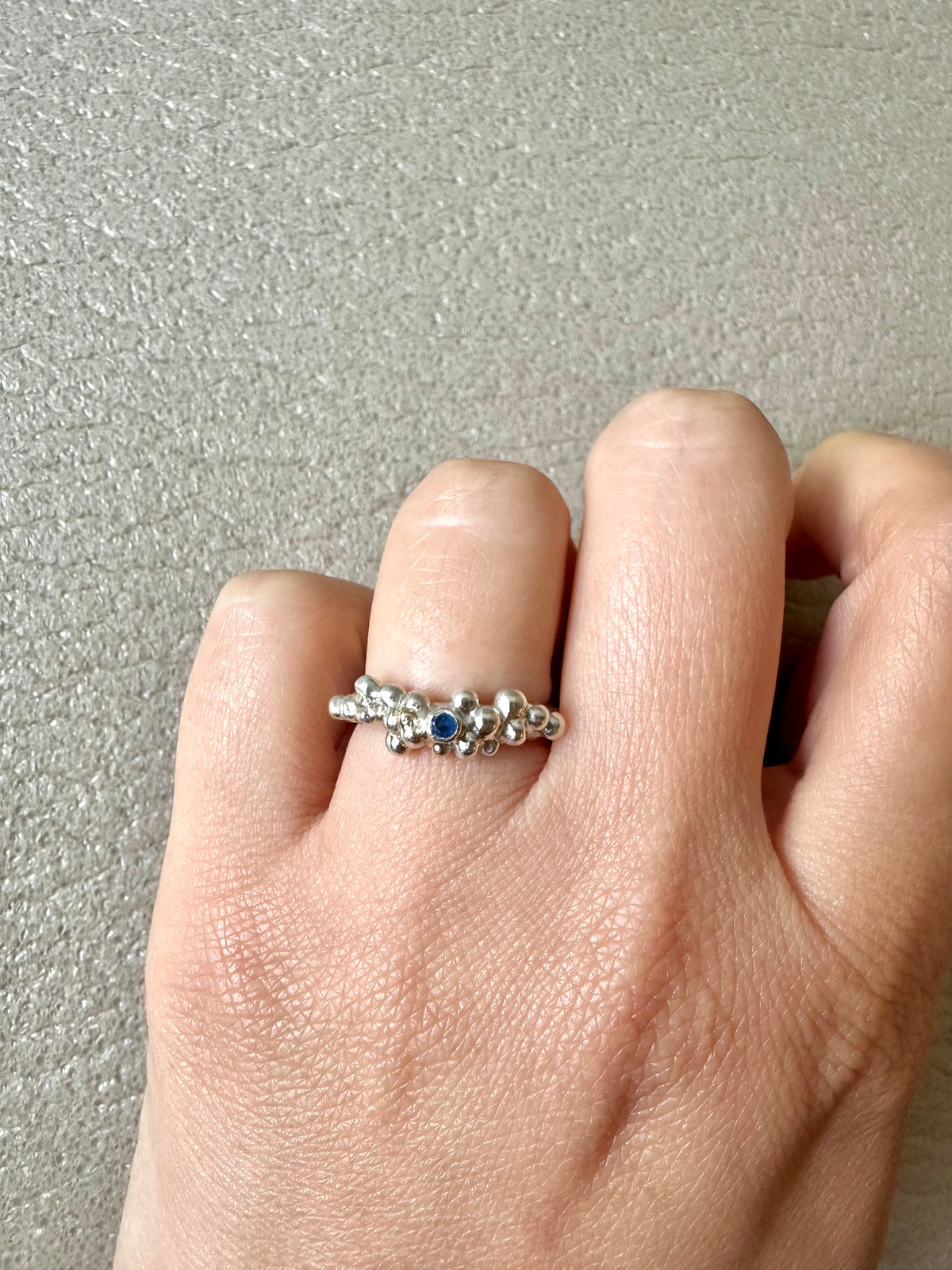 Sterling silver sapphire ring with granules that include some 9K gold