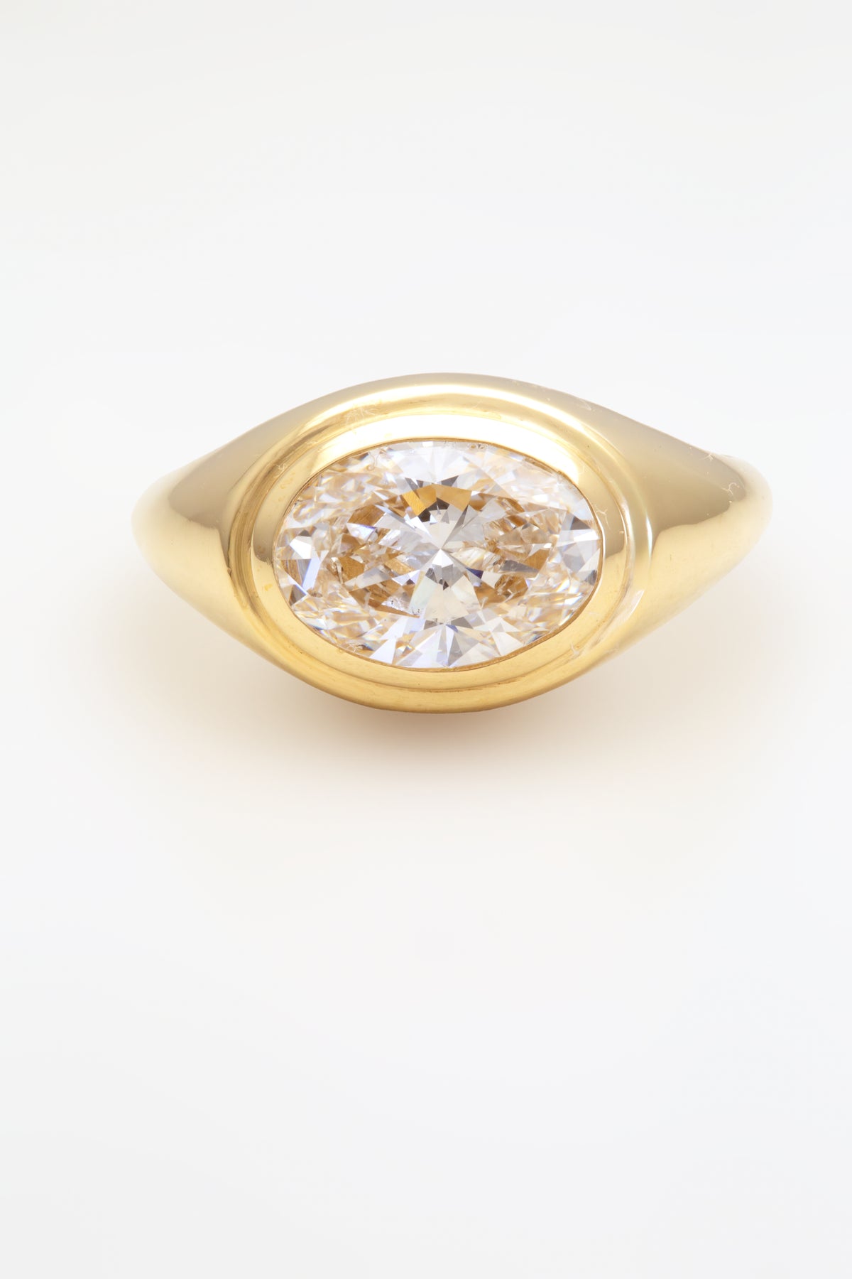 18K oval lab diamond signet ring with a bezel set stone | Yasmin Nabulsi Fine Jewelry