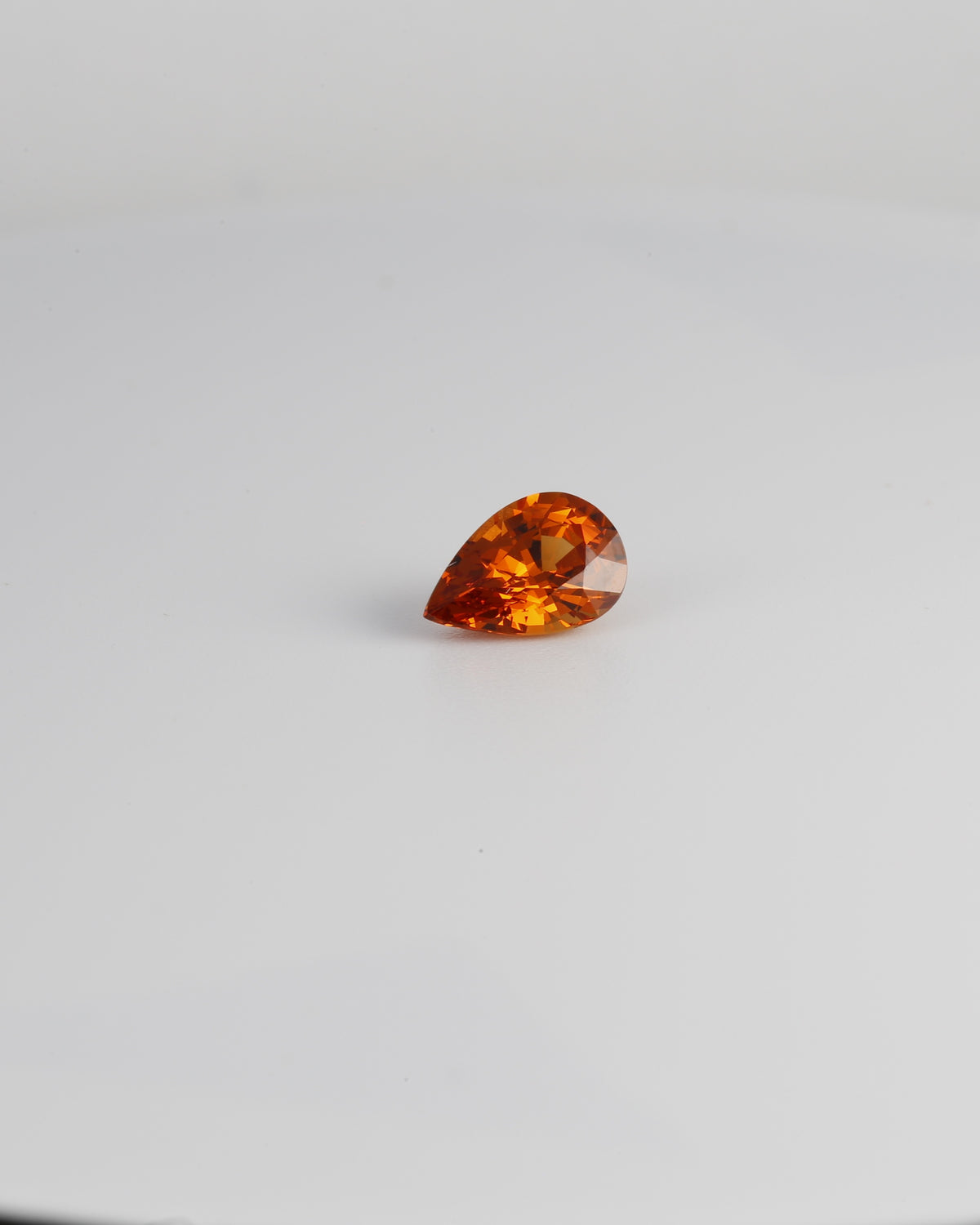 Pear cut spessartite garnet, fifth view, measuring 8.0x5.4mm