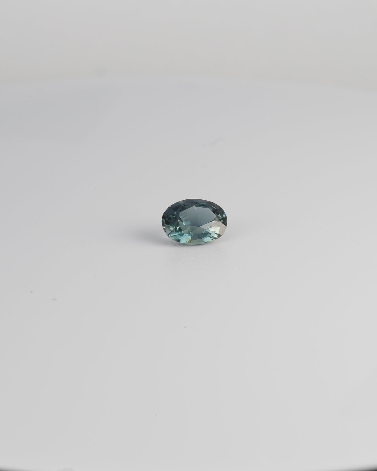 Unheated teal sapphire gemstone, mixed oval cut, 0.73 carats | Yasmin Nabulsi Fine Jewelry