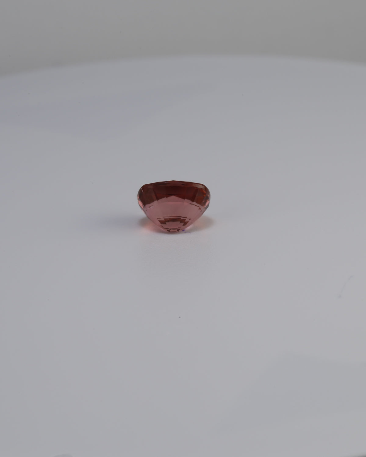 Peach cushion cut tourmaline weighing 1.42 carats, custom design quote available