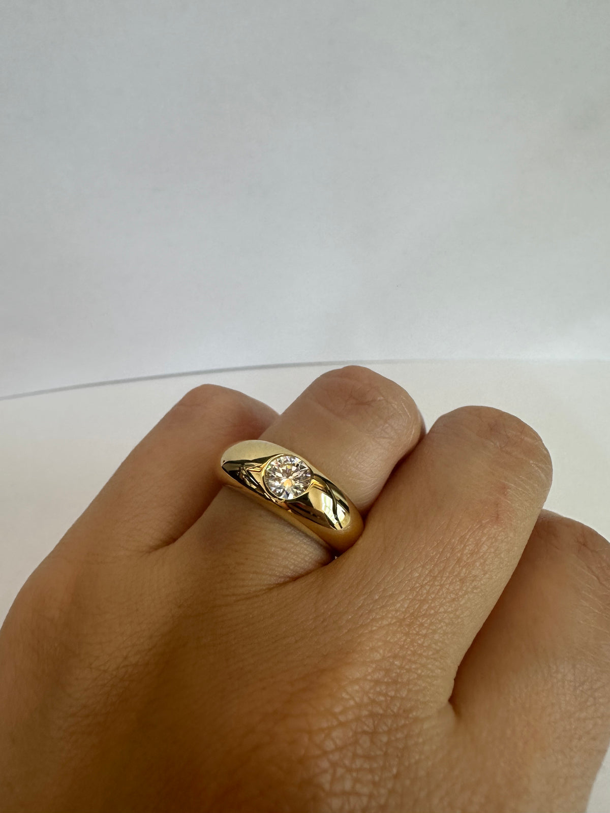 Chunky gold ring with a lab grown diamond and hollow back