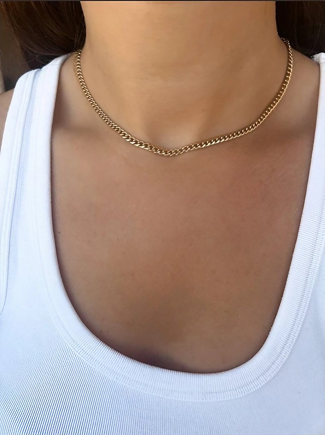 Cuban link necklace in 18K gold, styled for everyday wear