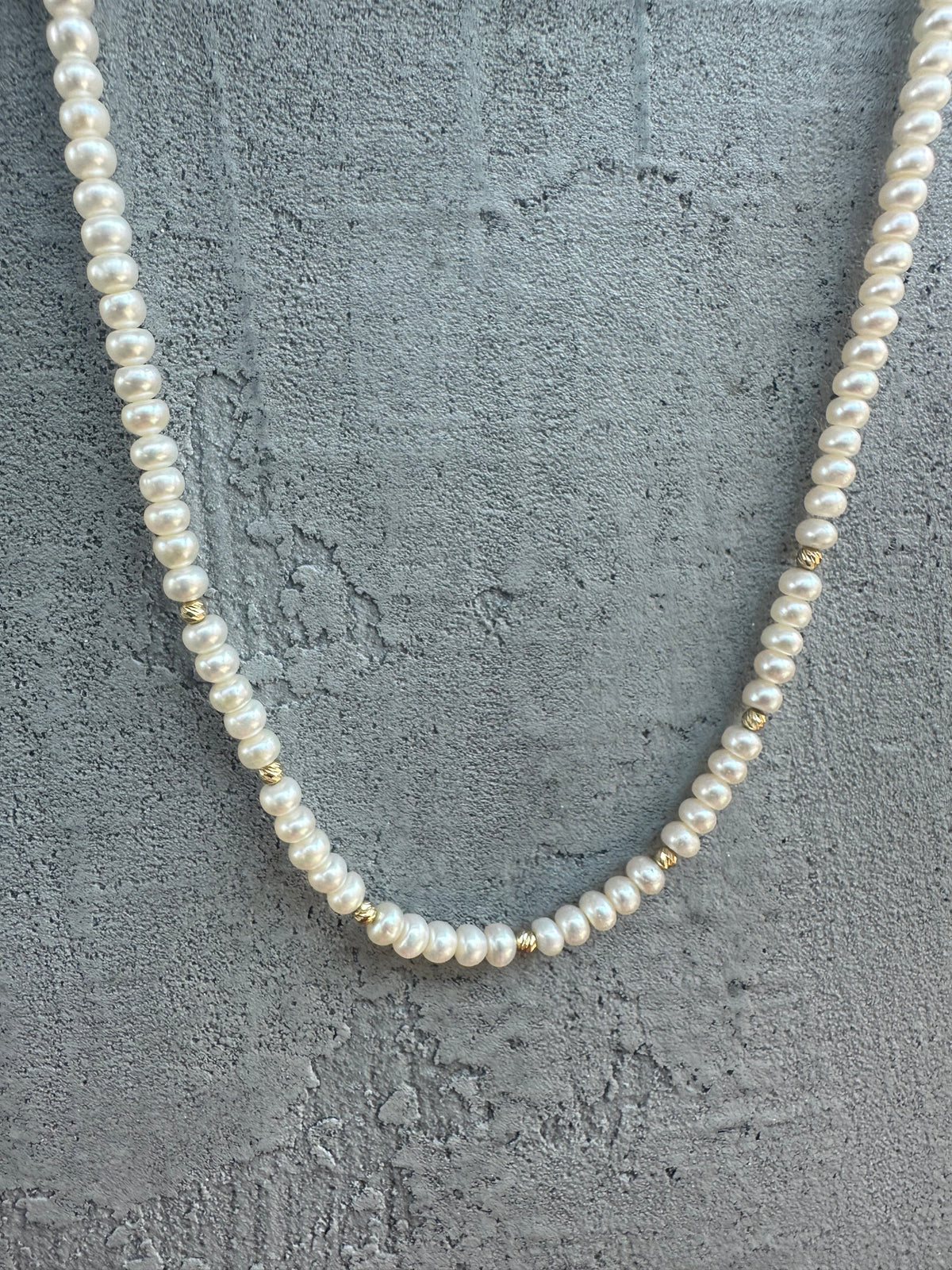 Dainty pearl necklace with seven 18K gold beads and a chain extender | Yasmin Nabulsi Fine Jewelry