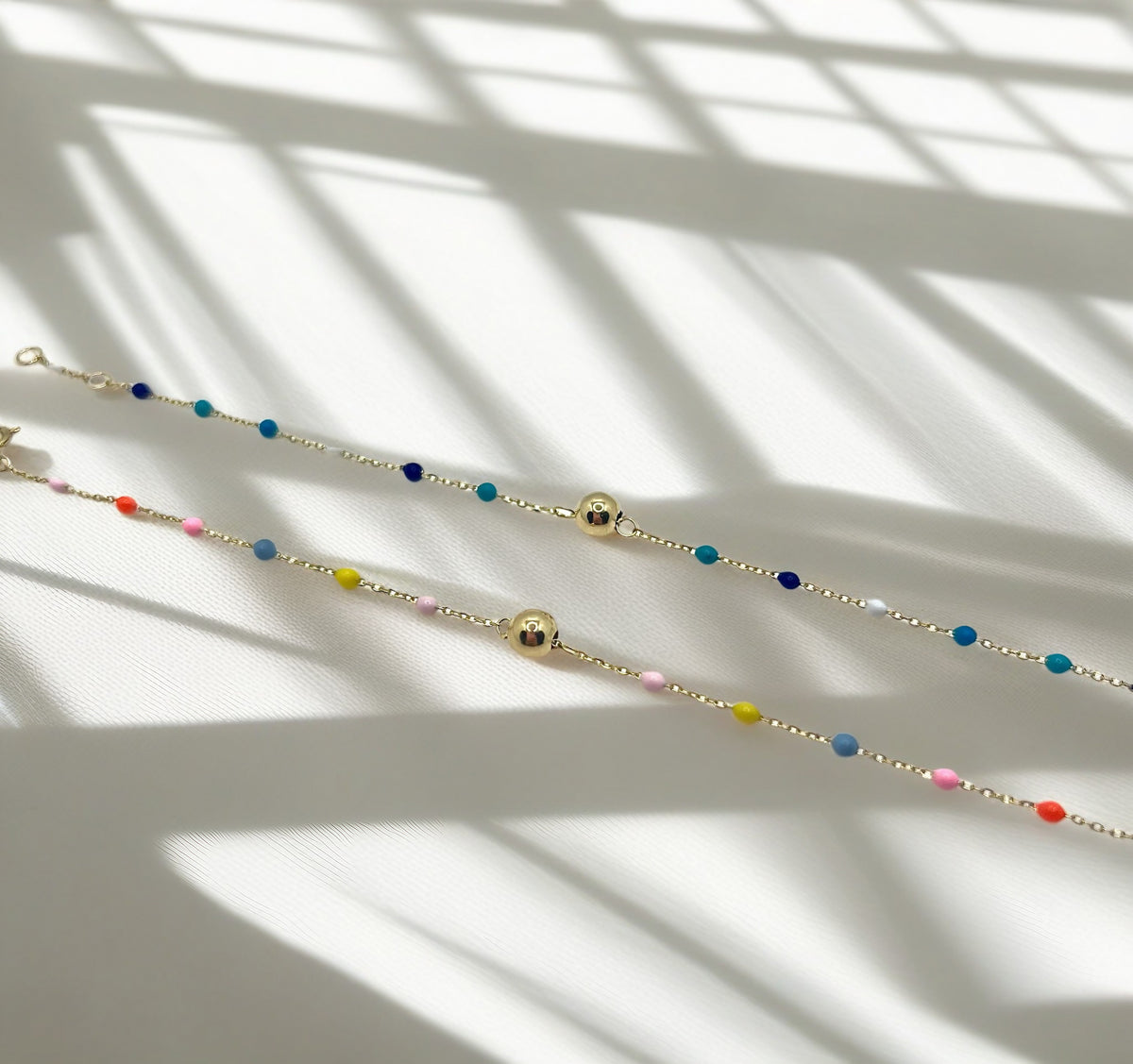 Gold ball bracelet with colorful enamel beads, handcrafted with some size and shape variation