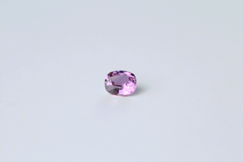 Pink sapphire gemstone, 0.74 carat cushion cut, shown in a 360 degree view