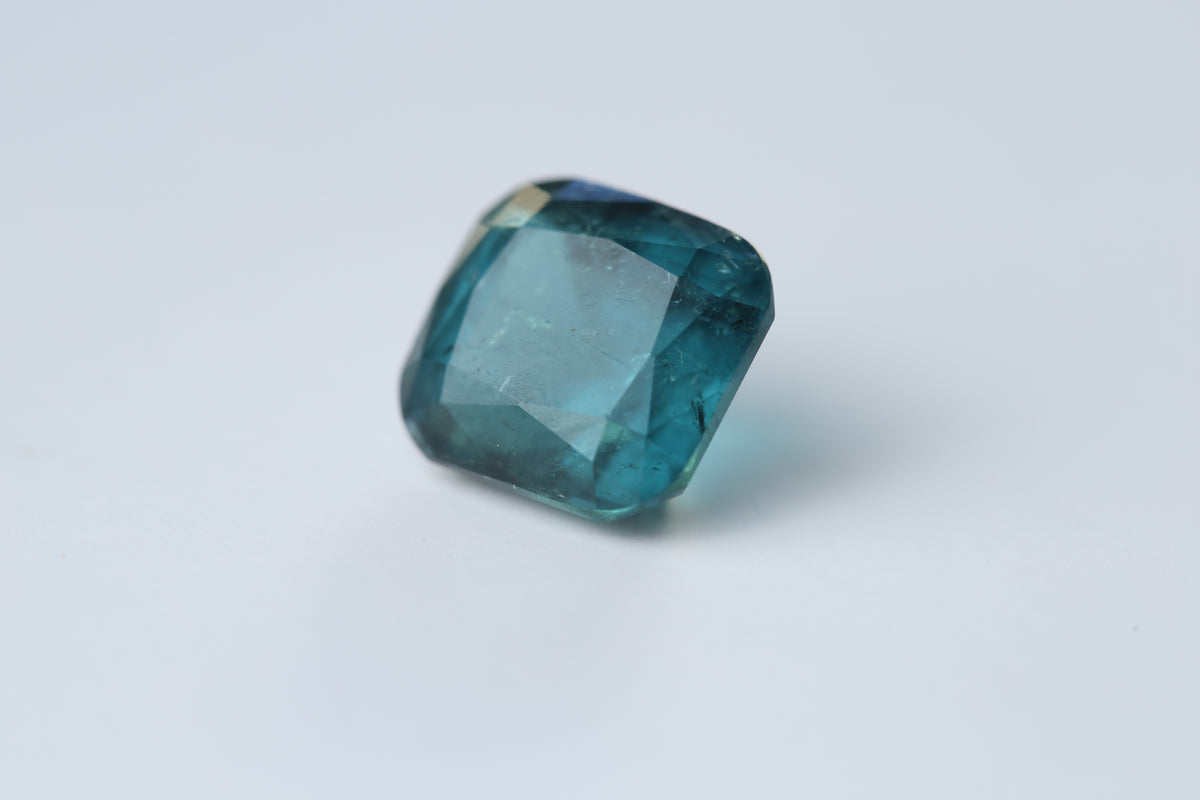 Cushion-cut indicolite tourmaline gemstone, 12.44 by 11.57 by 8.90 mm