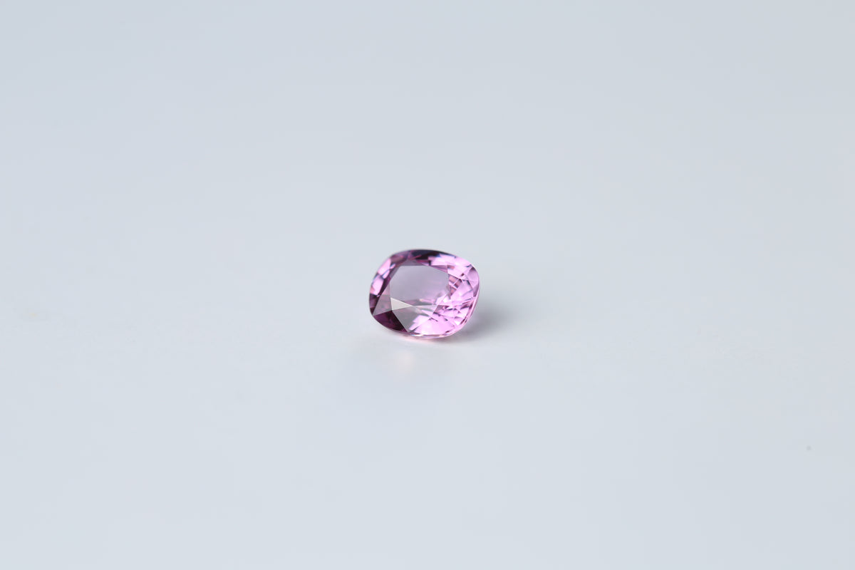 Unheated pink sapphire, cushion cut, measuring 5.6 x 4.8 mm