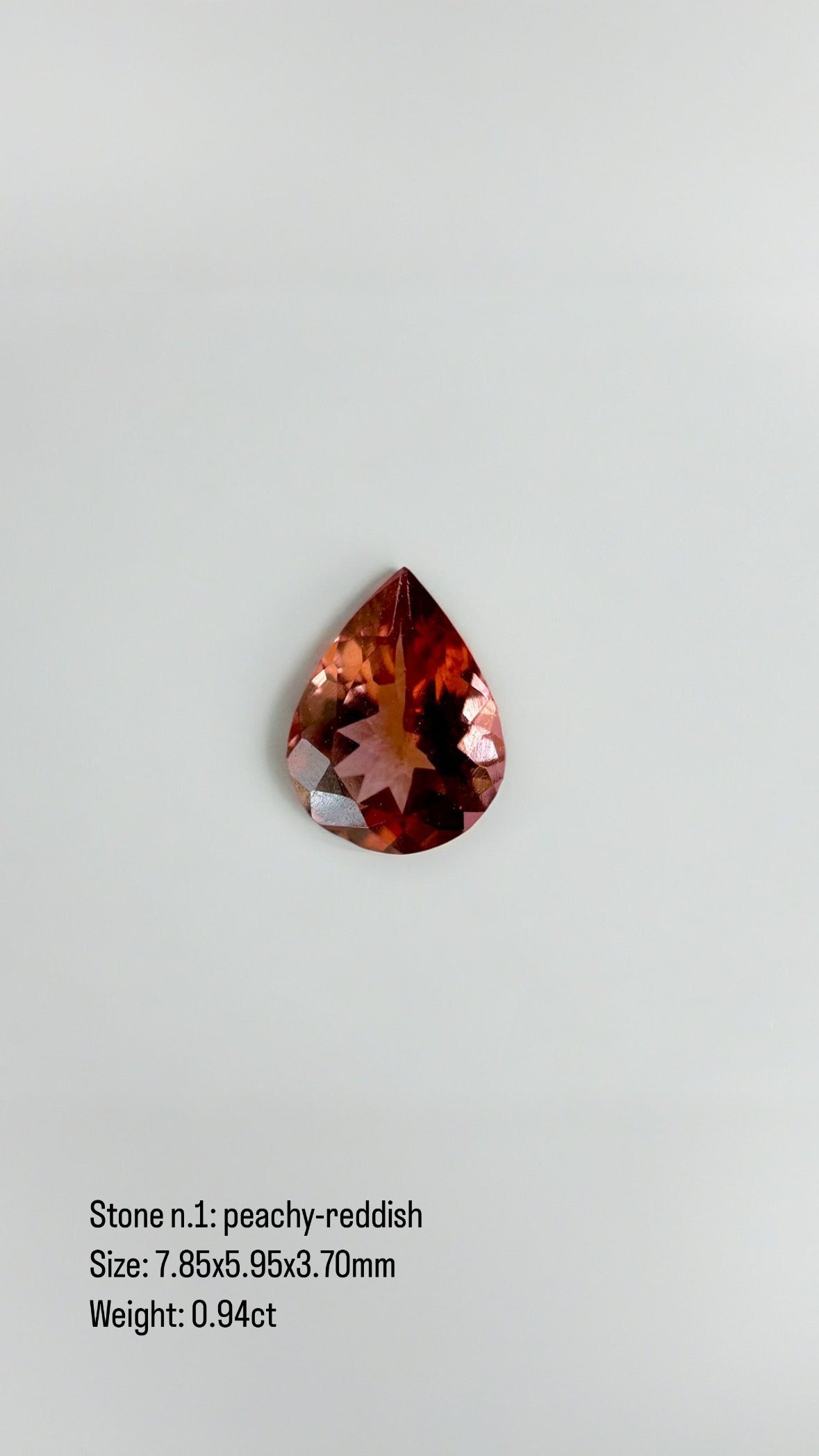 Teardrop gemstone pendant with a prong set stone, 18K yellow gold