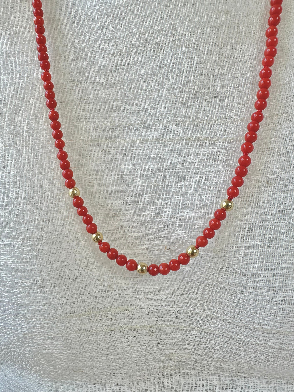 Red coral beaded necklace with 18K solid gold beads and 14K gold lobster clasp | Yasmin Nabulsi Fine Jewelry