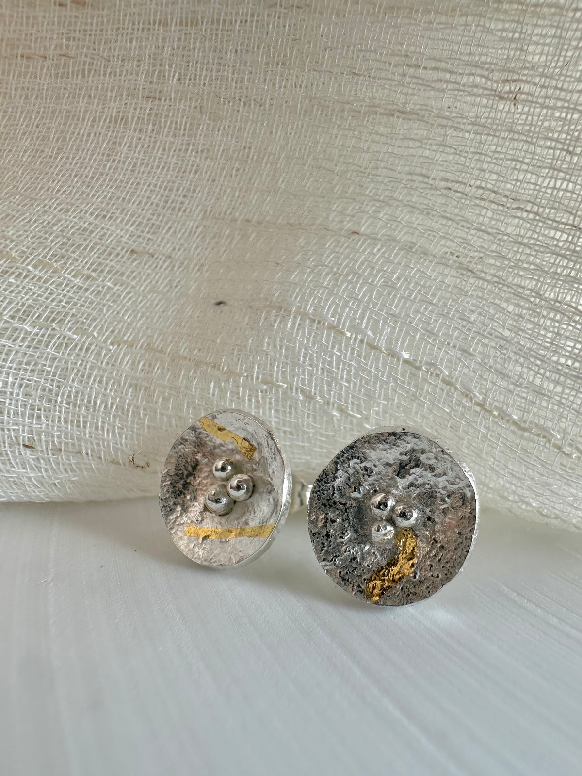 Round reticulated silver earrings, slightly concave, with gold foil | Yasmin Nabulsi Fine Jewelry