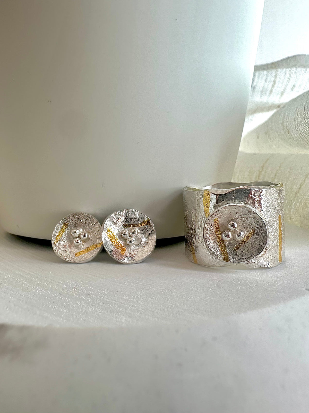 Reticulated silver disc stud earrings with gold foil