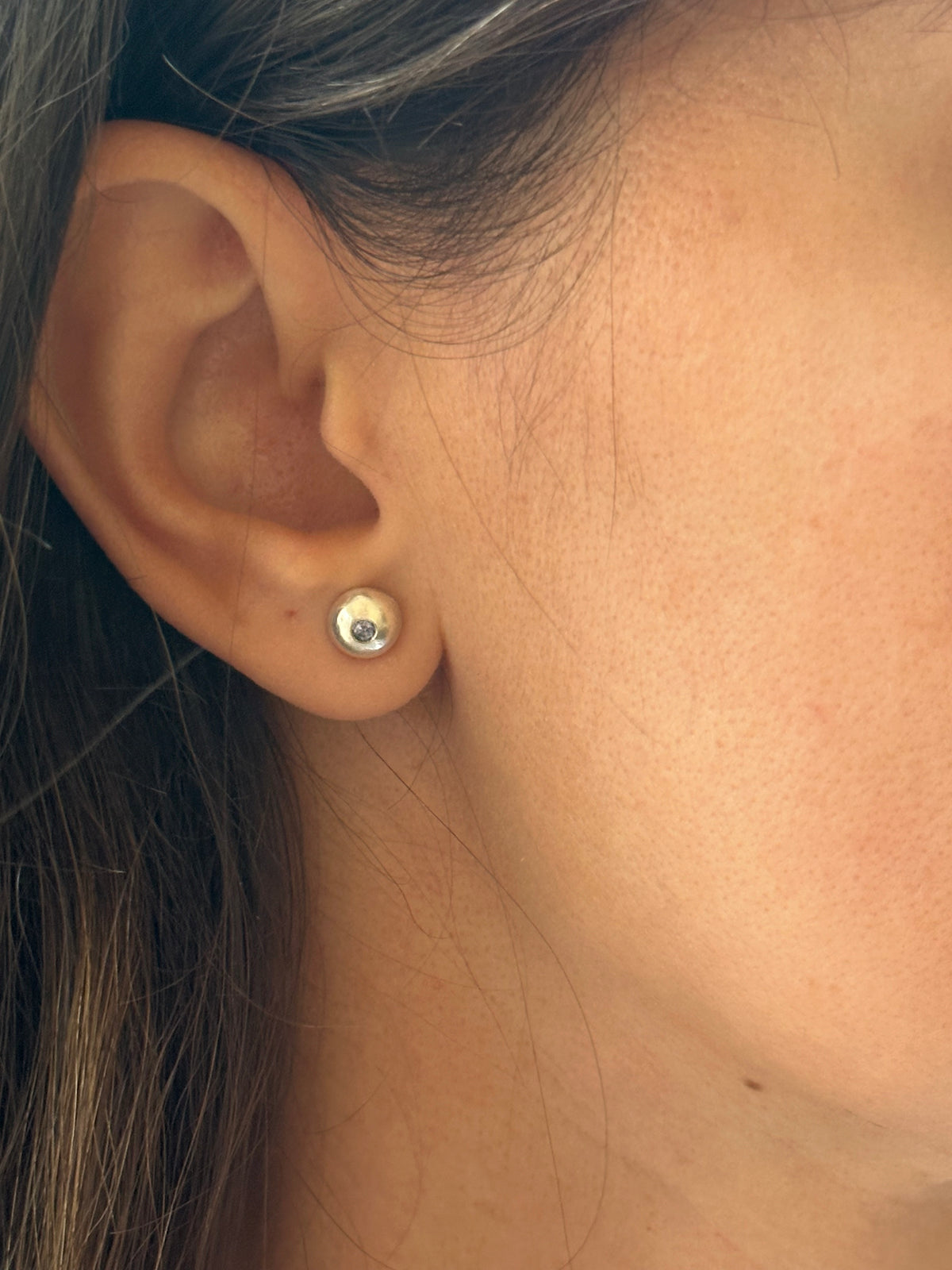 Recycled sterling silver button stud with a 2 to 2.5mm sapphire set flush
