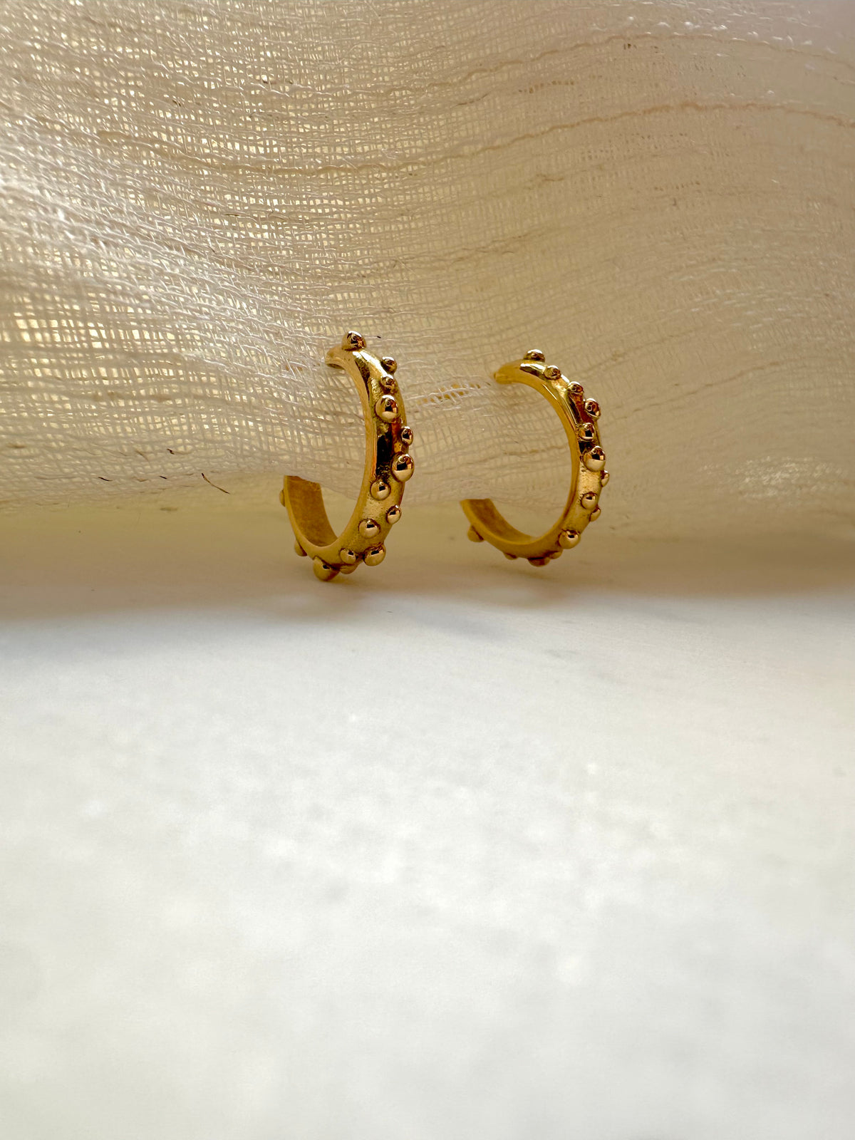 Solid gold hoop earrings, 11mm round, in 14K or 18K gold with a polished finish | Yasmin Nabulsi Fine Jewelry