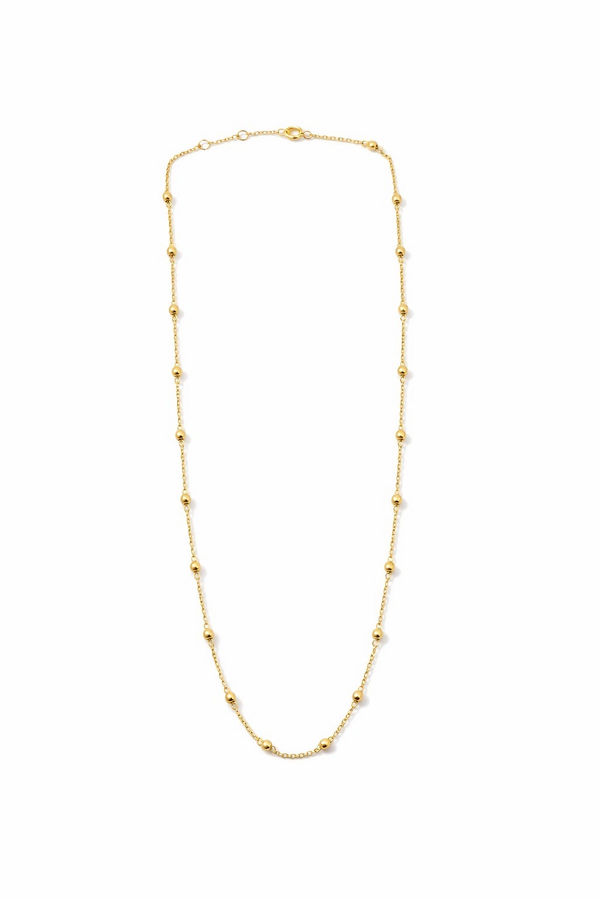 Gold beads individually and manually wrapped onto the 18K ball chain
