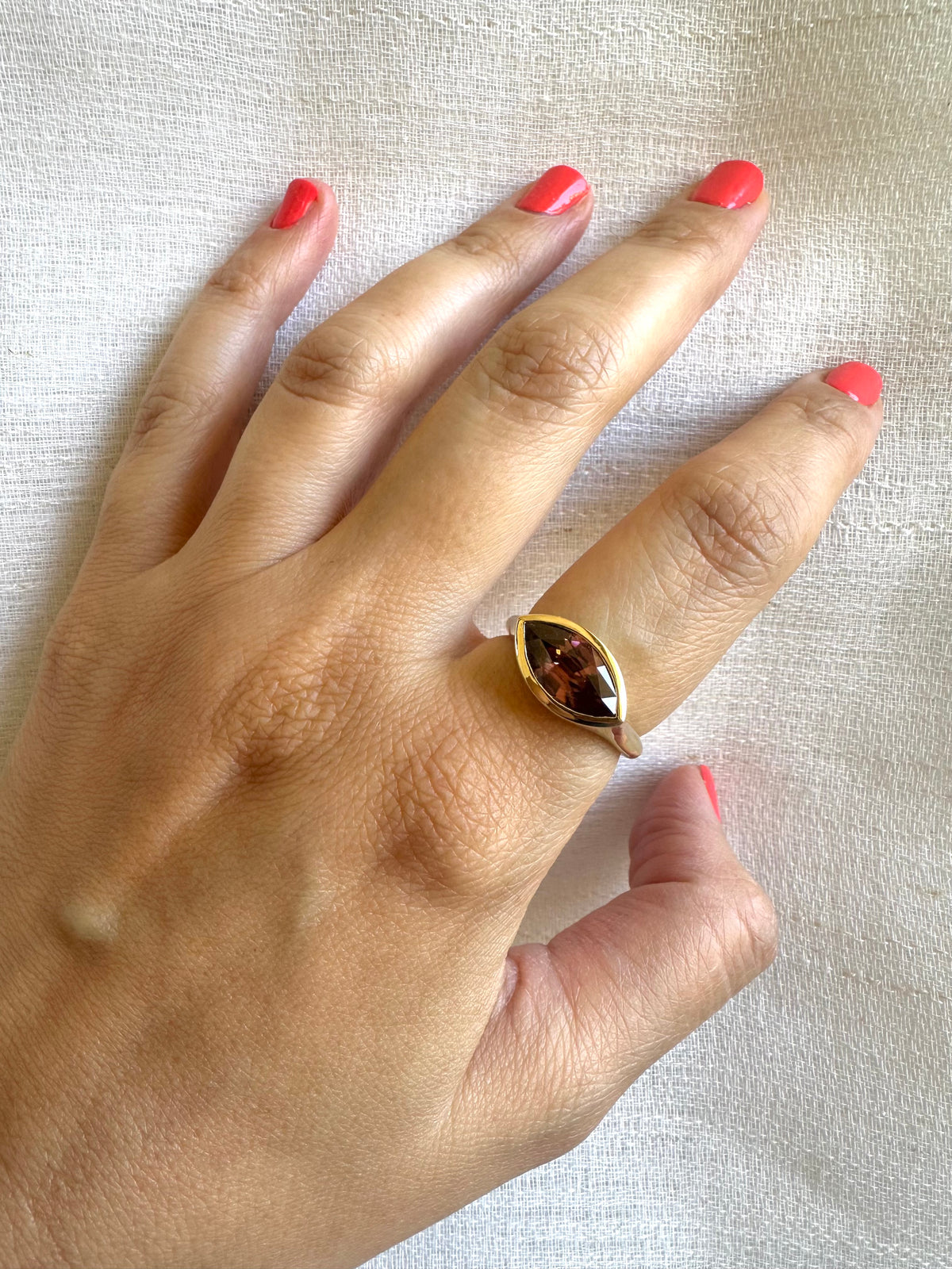 Natural zircon signet ring in 18K gold, with slight color variation from lighting